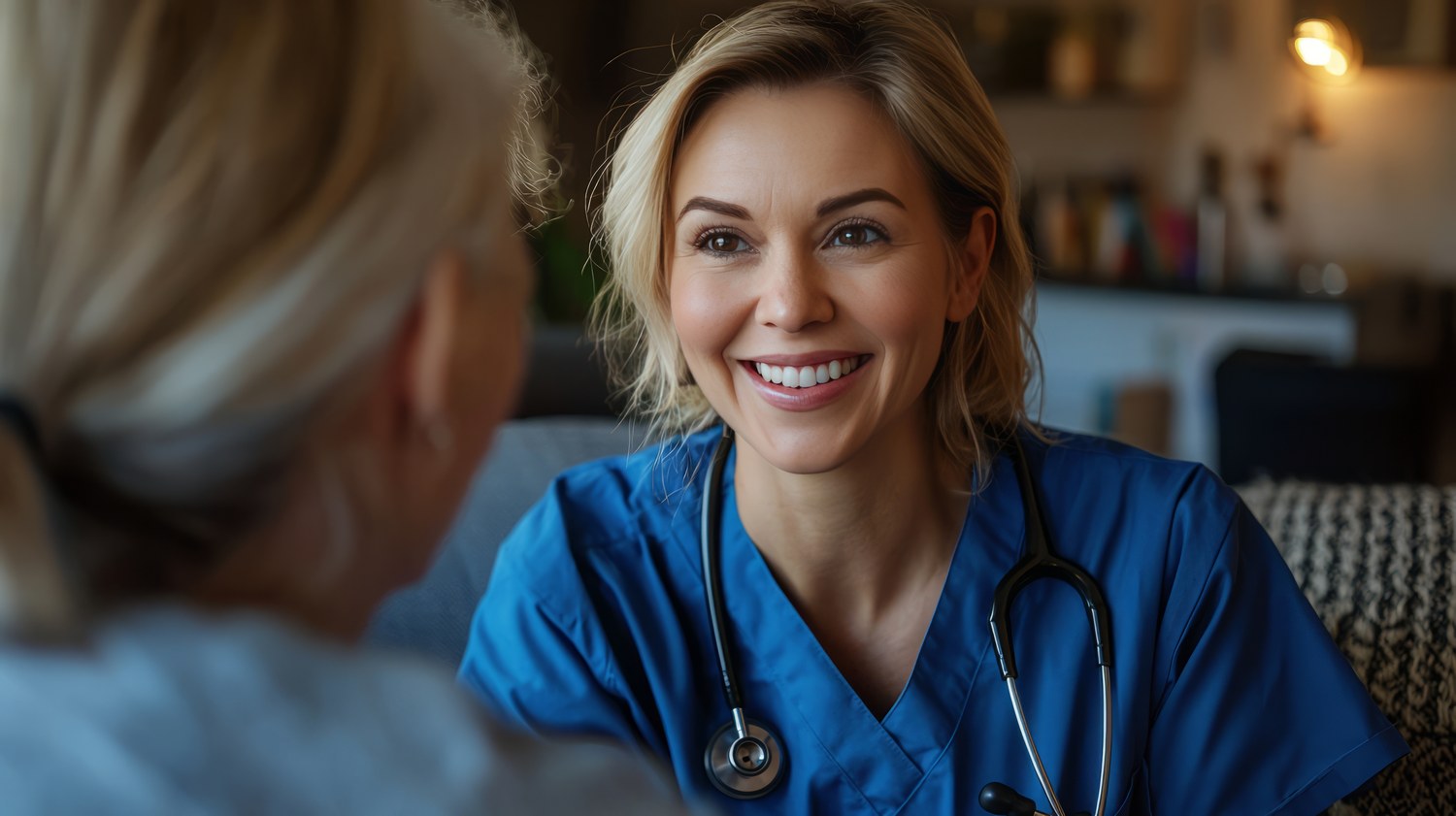 Gretchen Hess, RN, with a patient in their home