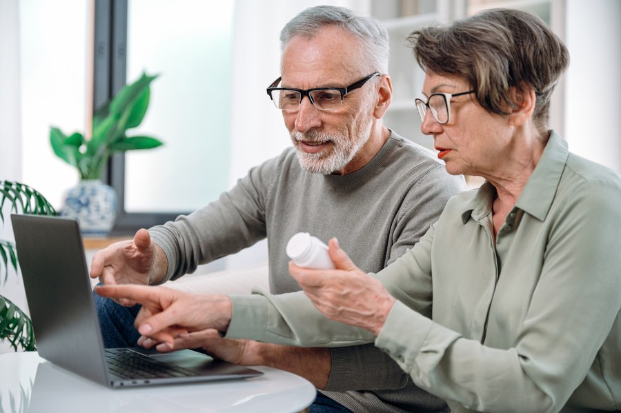 Older couple reviewing medication information together